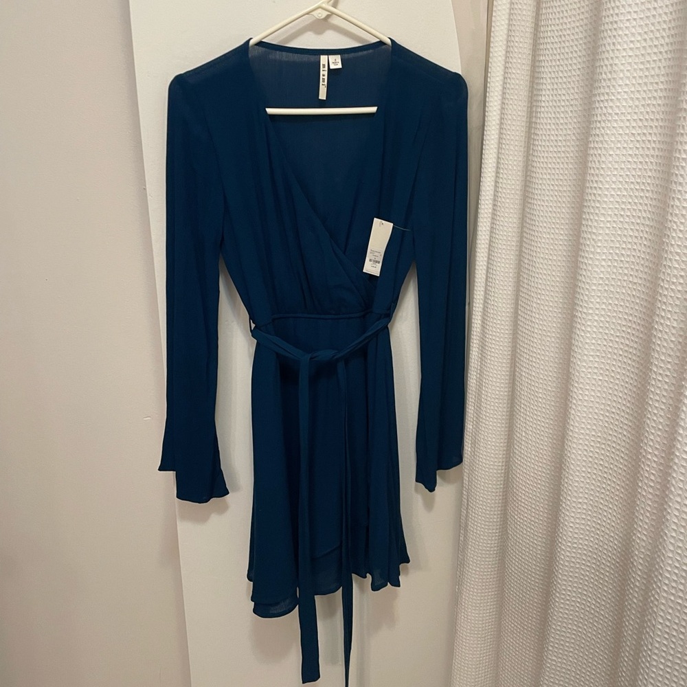 NWT Francesca’s Collections Miami mini wrap dress with bell sleeves.